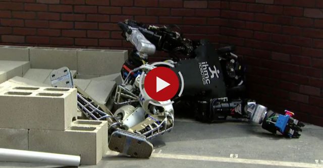 Robots Falling Down At DARPA Robotics Challenge