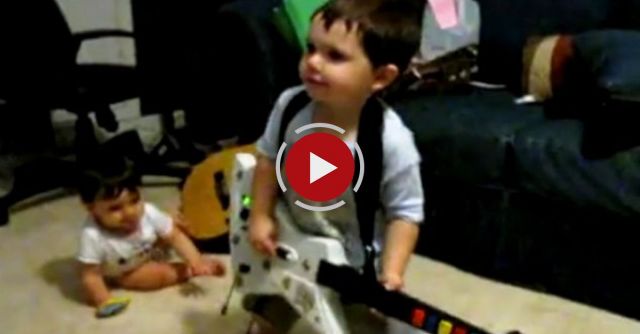 2 Year Old Playing Bulls On Parade On Guitar Hero.....the Music Takes Over.