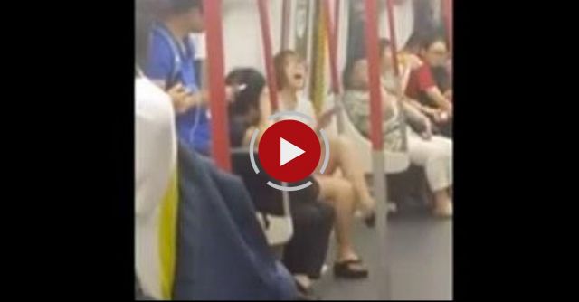 Woman On Hong Kong Subway Melts Down When Her Phone Battery Dies.