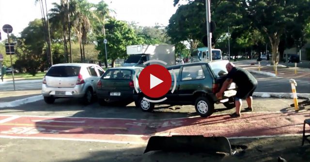 Biker Lifts Car Parked On Bicycle Path