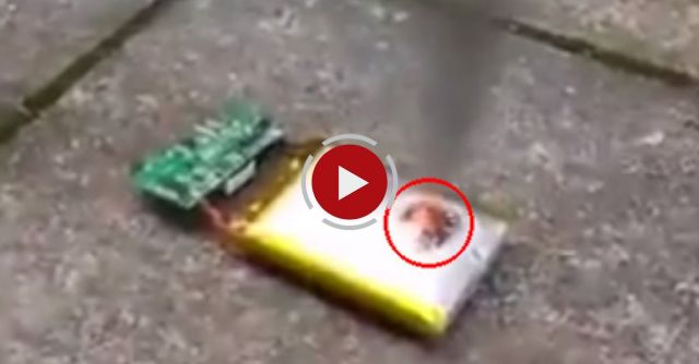 Poking A Phone Battery With A Knife