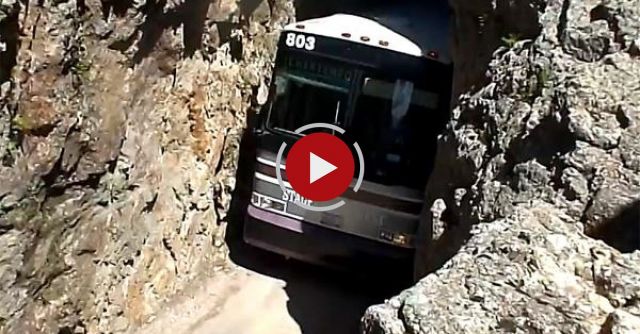 Charter Bus In Rock Tunnel