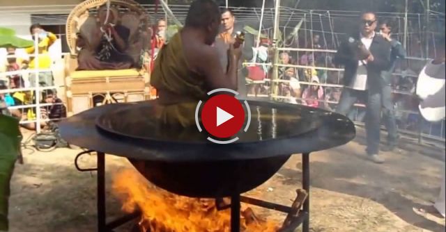 A Buddhist Monk Meditating In A Hot Oil Container