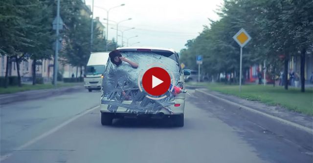 Russian Guy Gets Duct Taped To A Moving Car