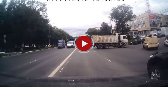 Dump Truck Reverses Into Traffic