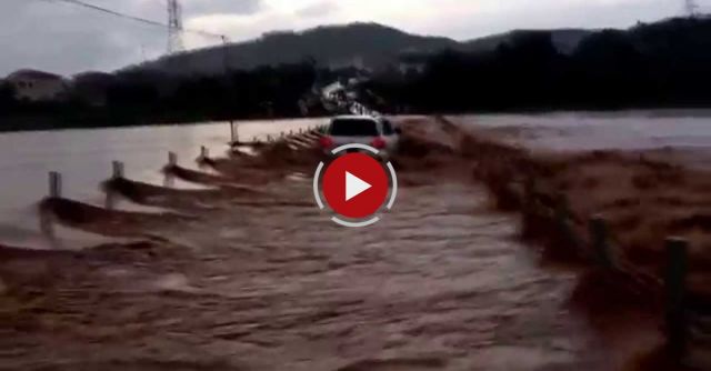 Crossing A Flooded River In A Toyota