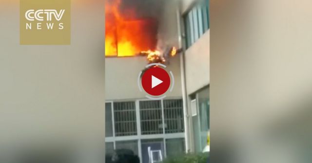 Raw Footage: Flaming Firefighter Jumps Out Of Burning Apartment