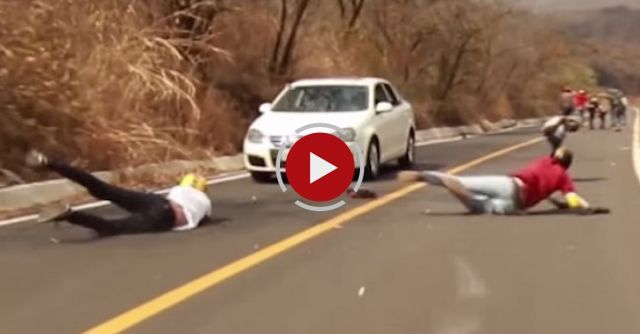 Longboarder Crashes Head First Into Oncoming Car