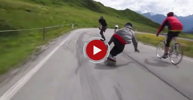 Crazy Downhill Skateboarders Flying By Cyclists