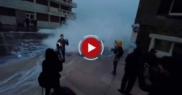 Reporter Slammed By Giant Wave.