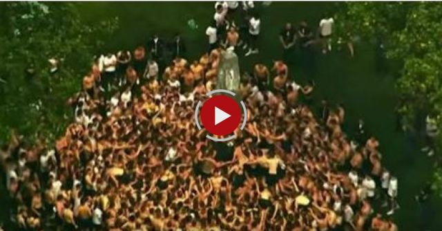 Raw: Hundreds Climb Monument At Naval Academy