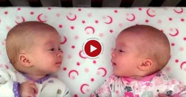 Identical Twin Girls Engage In Deep Conversation