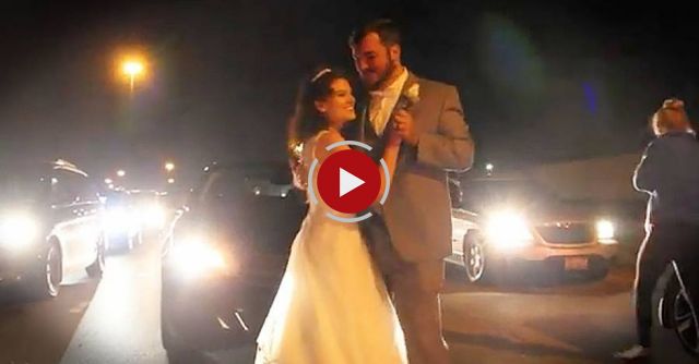 Bride and groom share their first dance on the freeway during traffic jam