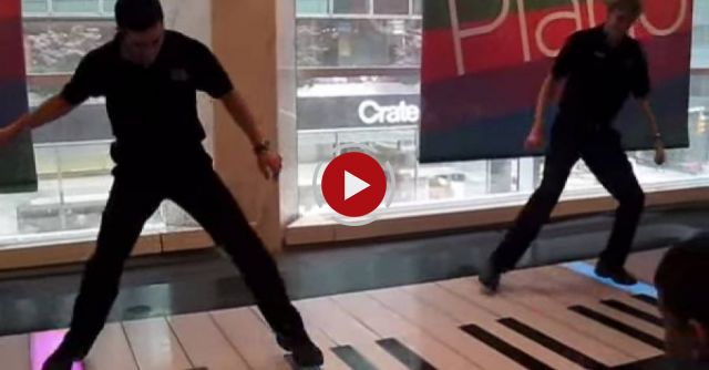 This giant piano looks impossible to play, but watch this duo prove you wrong